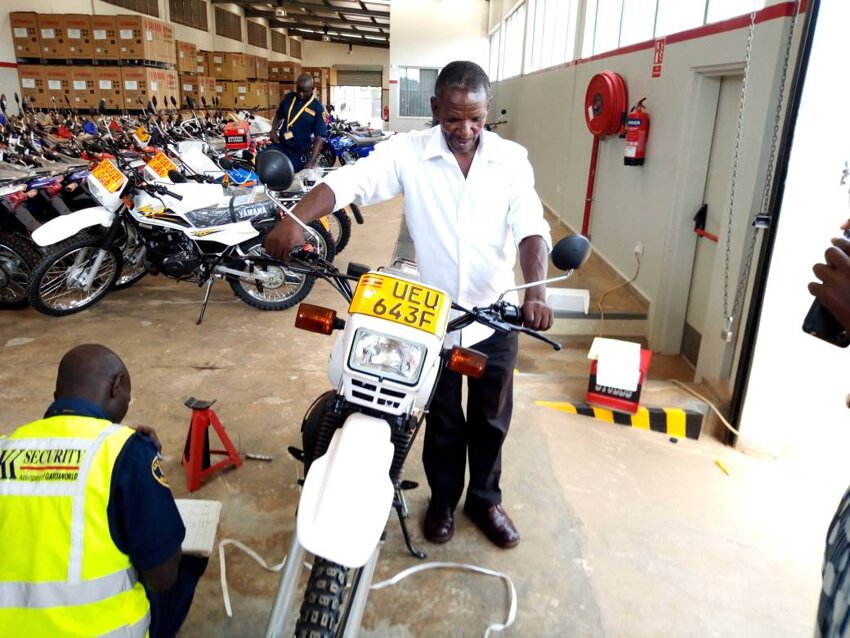 Image of Project Team member Zaire takes delivery of new motorbike